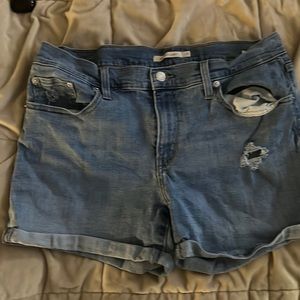 Levi cuffed mid wash jean shorts